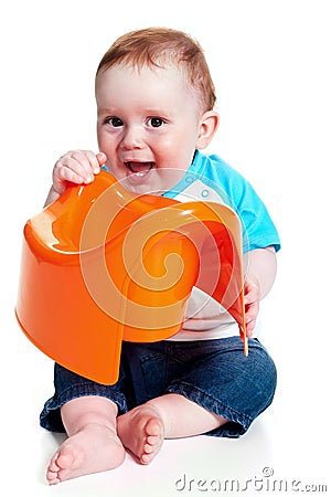Little boy holding potty Stock Photo