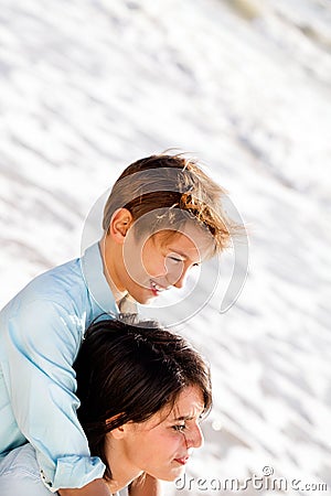 Little boy hugs his mother looking at the scenery seaside Stock Photo