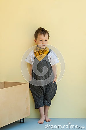 Little boy in a jumpsuit Stock Photo