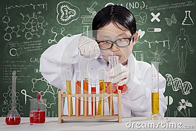 Little boy learning chemistry in the lab Stock Photo