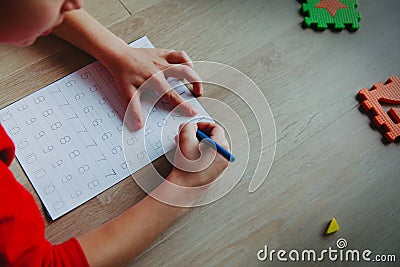 Little boy learning write and culculate numbers Stock Photo