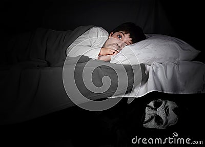 Little boy and monster under the bed. Stock Photo