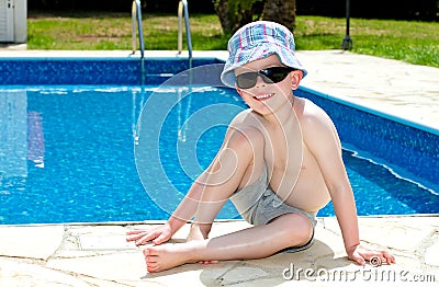 Little boy oiled up with sun cream Stock Photo