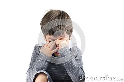 Little boy pain his eyes put finger isolayr on white backgroud Stock Photo