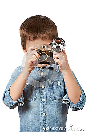 Little boy photographer shooting with retro camera and flash Stock Photo