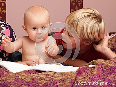 Little boy playing with a brother Stock Photo