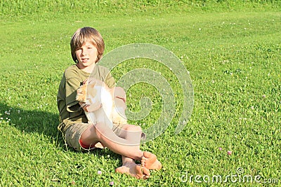 Little boy playing with a cat Stock Photo