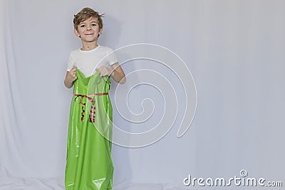 Little boy playing with an empty bag Stock Photo