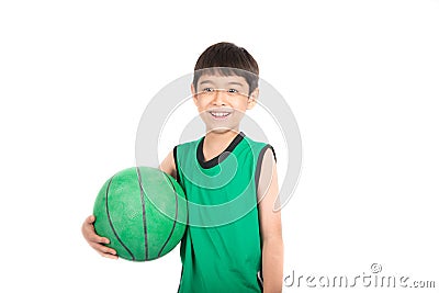 Little boy playing green basketball in green PE uniform sport Stock Photo