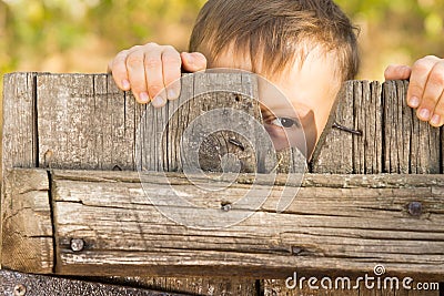 Little boy playing peek a boo Stock Photo