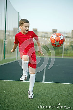 Little Boy Playing Soccer. Sport kid. Child with Ball Stock Photo