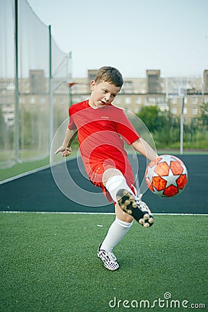 Little Boy Playing Soccer. Sport kid. Child with Ball Stock Photo