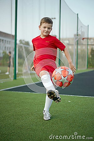 Little Boy Playing Soccer. Sport kid. Child with Ball Stock Photo