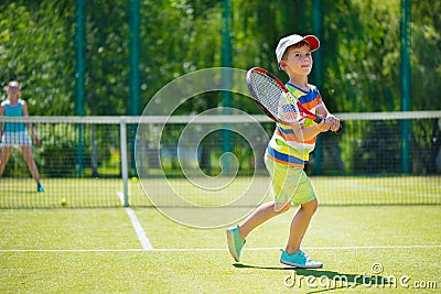 Little boy playing tennis Stock Photo