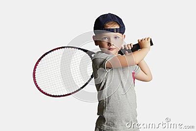 Little Boy Playing Tennis. Sport kids.Child with Tennis Racket Stock Photo