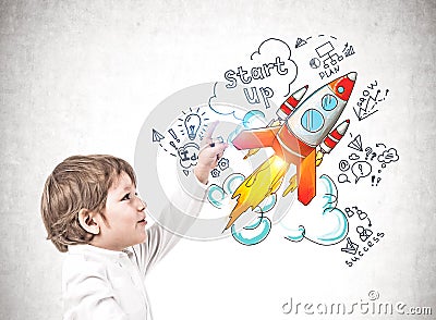 Little boy pointing at startup sketch Stock Photo