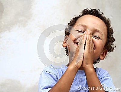 Little boy praying to God Stock Photo