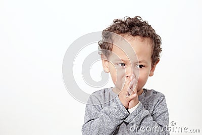 Little boy praying to God Stock Photo