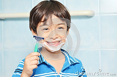 Little boy pretending to shave Stock Photo