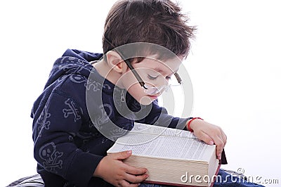 Little boy reading a book Stock Photo