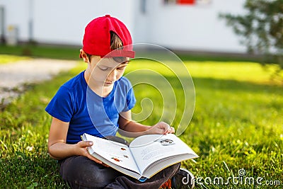 Little boy reading fable book Stock Photo