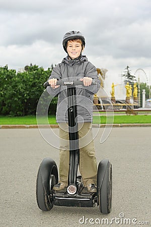 Little boy ride on segway Stock Photo