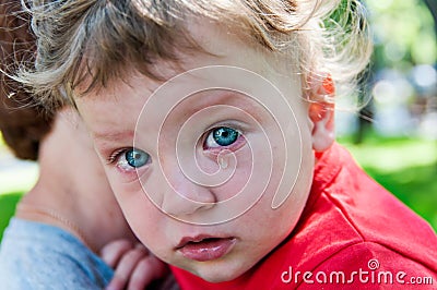 Little boy's crying at her mother in her arms Stock Photo