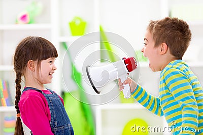 Little boy shouting loud to girl Stock Photo