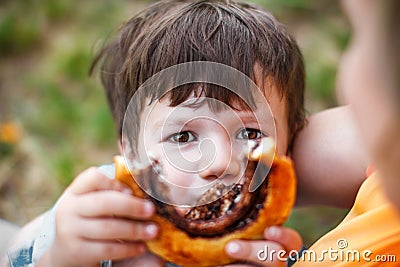 Little boy showing cocoa snail Stock Photo