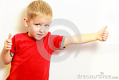 Little boy showing thumb up success hand sign gesture. Stock Photo