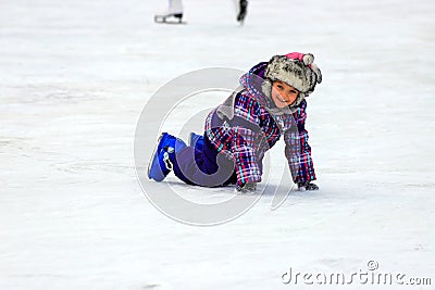 A little boy skates and falls on the ice in children skate rink Active family sport , winter holidays, sports club Editorial Stock Photo