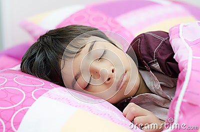 Little boy sleeping in bed Stock Photo