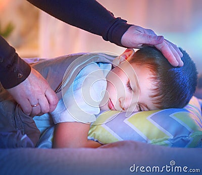 Little boy sleeping and dreaming in his bed Stock Photo