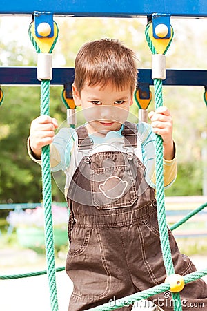 A little boy smiling and playing Stock Photo