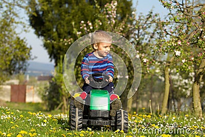 Little boy and tractor. Stock Photo