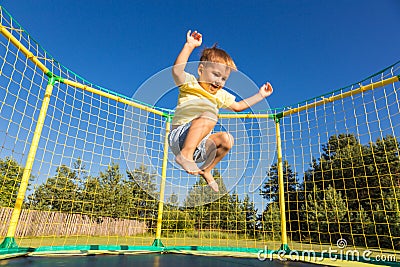 Little boy on a trampoline Stock Photo