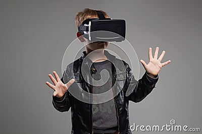 Little Boy in virtual reality glasses playing the game. kids fun Stock Photo