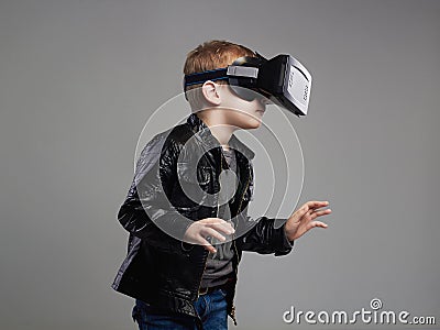 Little Boy in virtual reality glasses playing the game. kids fun Stock Photo