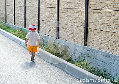 Little boy walking away Stock Photo
