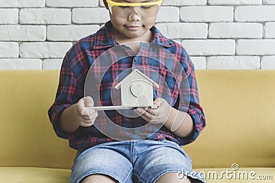 Little boy wearing a engineering helmet Stock Photo