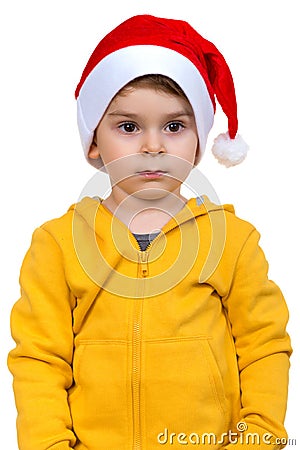 Little boy wearing on red Santa helper hat. Isolated over white background. Stock Photo