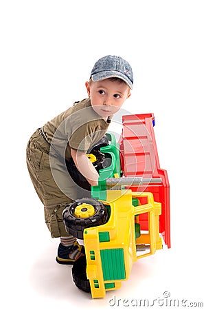 Little boys play with toy truck Stock Photo