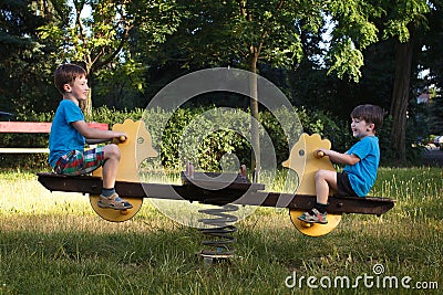 Little boys on seesaw Stock Photo