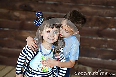Little brother hugging little sister Stock Photo