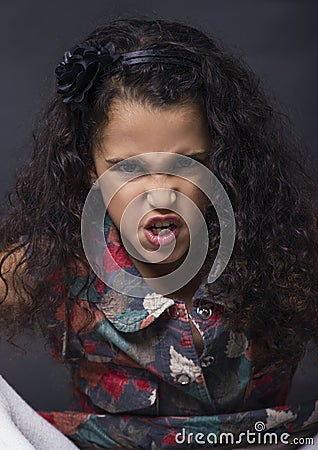 Little brunette angry girl Stock Photo