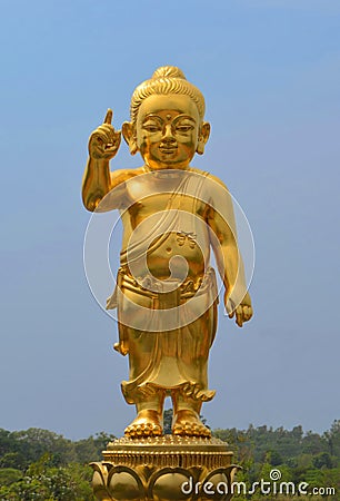 The little Buddha golden statue at Lumbini, Nepal Stock Photo