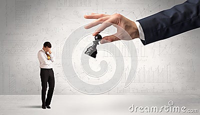 Businessman is afraid to make the next step in a chess game with graphs background Stock Photo