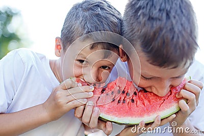 Little caucasian children eating watermelon Stock Photo