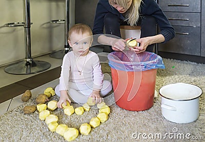 Little charming girl and potato heart. Stock Photo