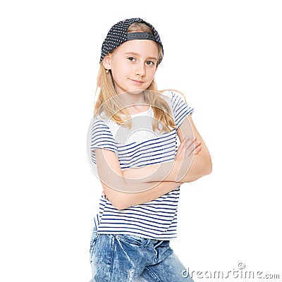 Little cheerful girl schoolgirl with blond hair and cap hat Stock Photo